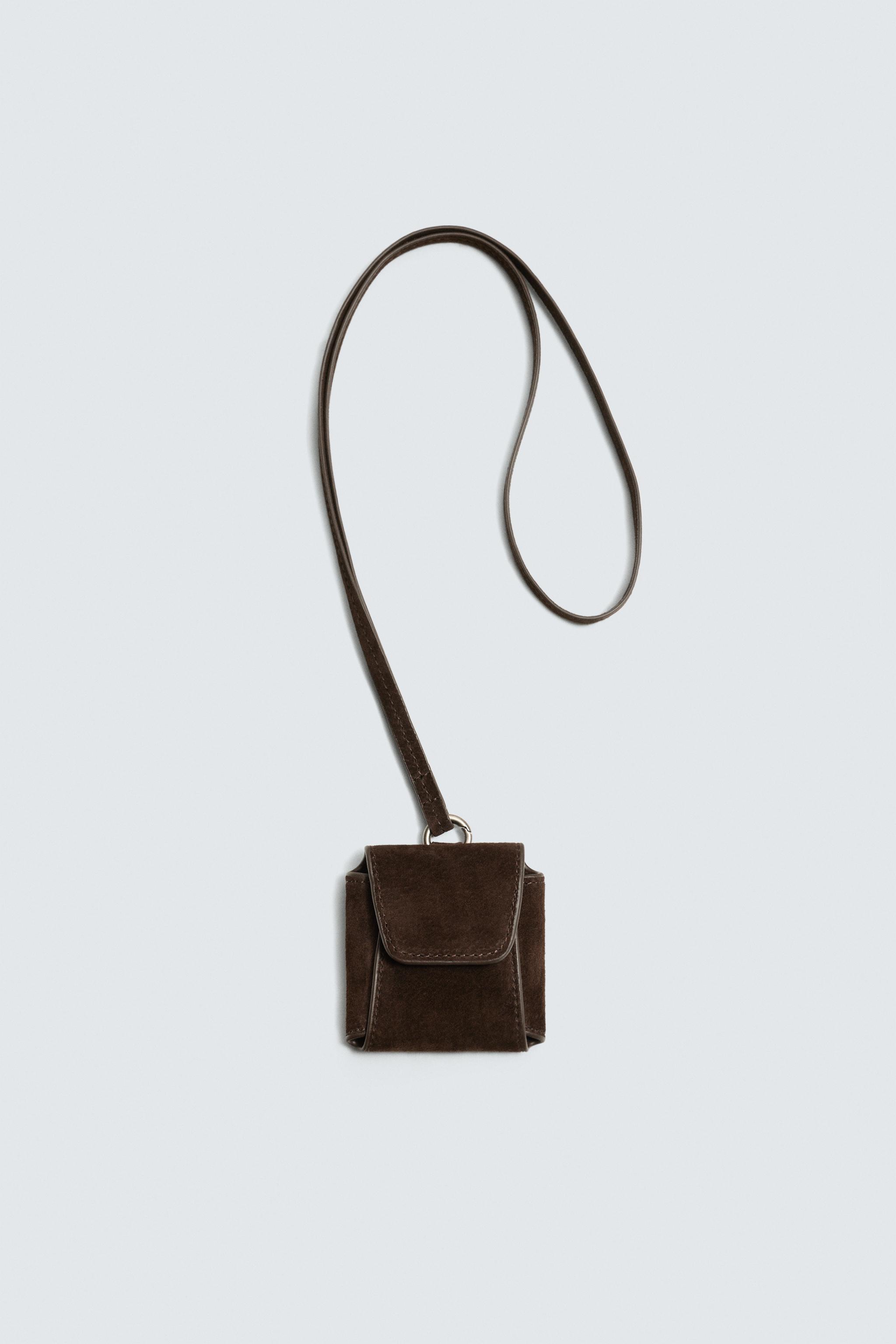 PORTE-ÉCOUTEURS EN CUIR AVEC PENDENTIF